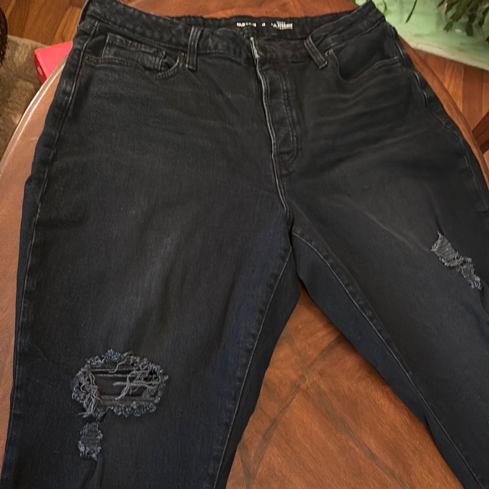Worn once and washed once. Basically new distressed black jeans. Button fly.
